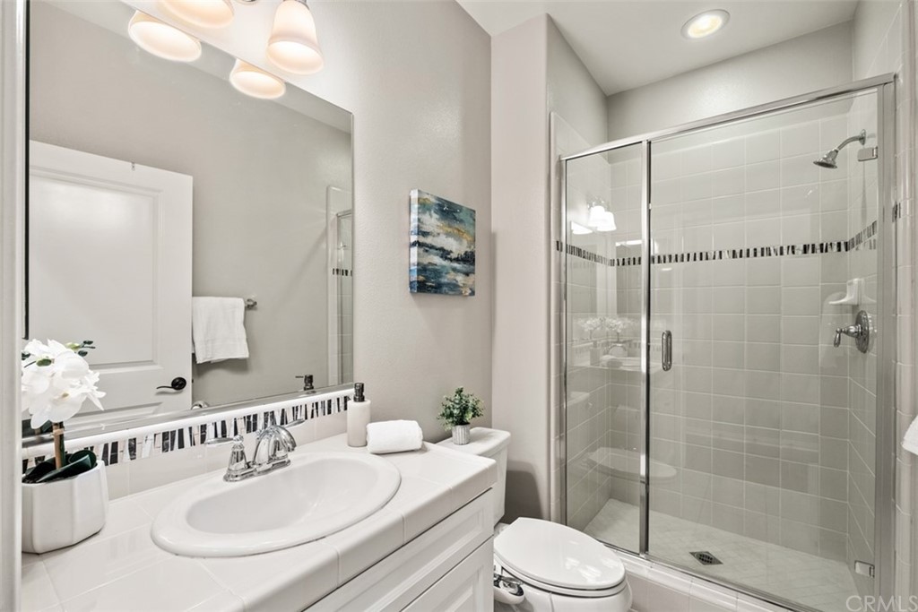 128 Long Grass Irvine, CA 92618 - Photo 20 of 42 a bathroom with a sink vanity granite toilet tub and shower