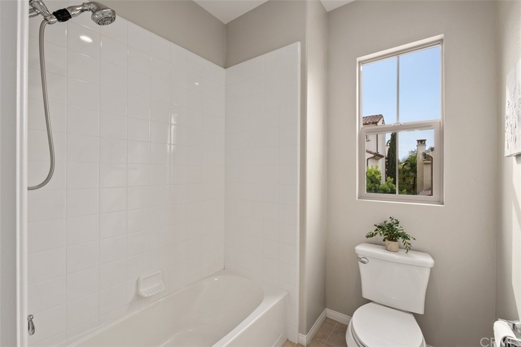 128 Long Grass Irvine, CA 92618 - Photo 29 of 42 a bathroom with a toilet a sink and bathtub