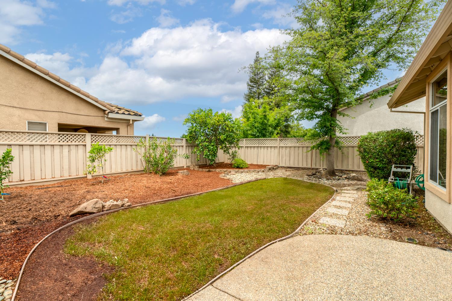 4081 Rose Creek Road Roseville, CA 95747 - Photo 43 of 52 a view of a patio with a table and chairs and potted plants