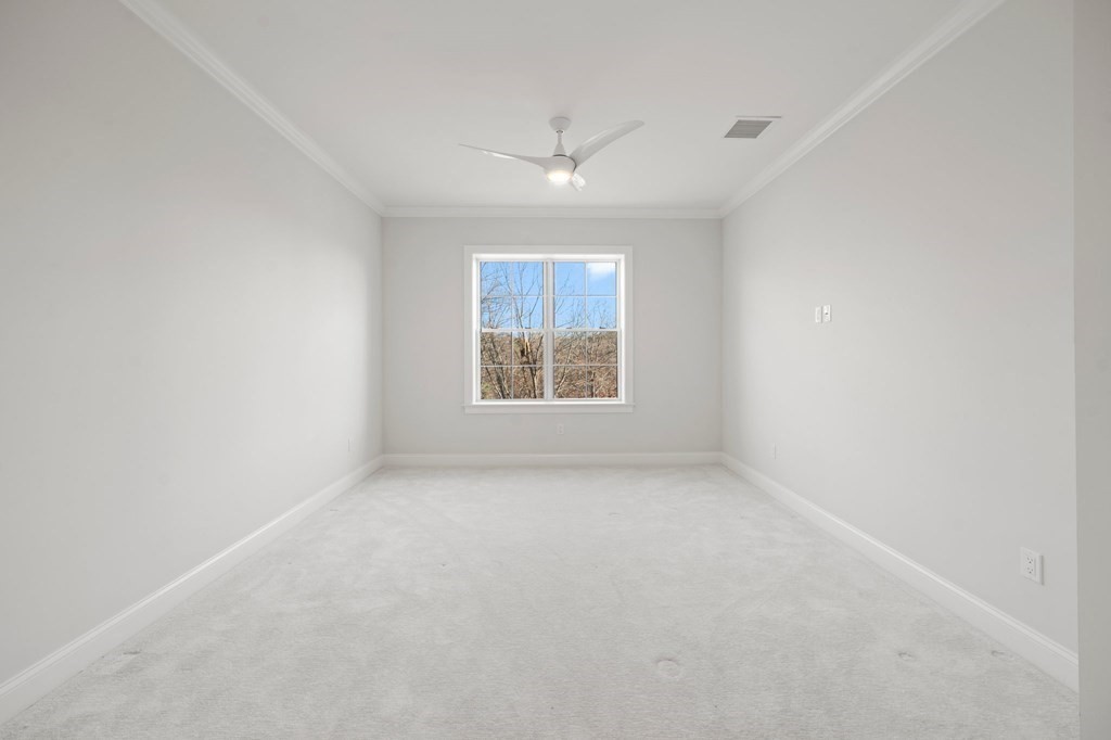 60 Coppersmith Way, Unit 404 Canton, MA 02021 - Photo 24 of 42 an empty room with a window