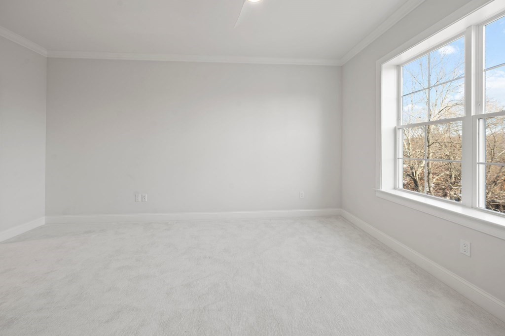 60 Coppersmith Way, Unit 404 Canton, MA 02021 - Photo 26 of 42 an empty room with a window
