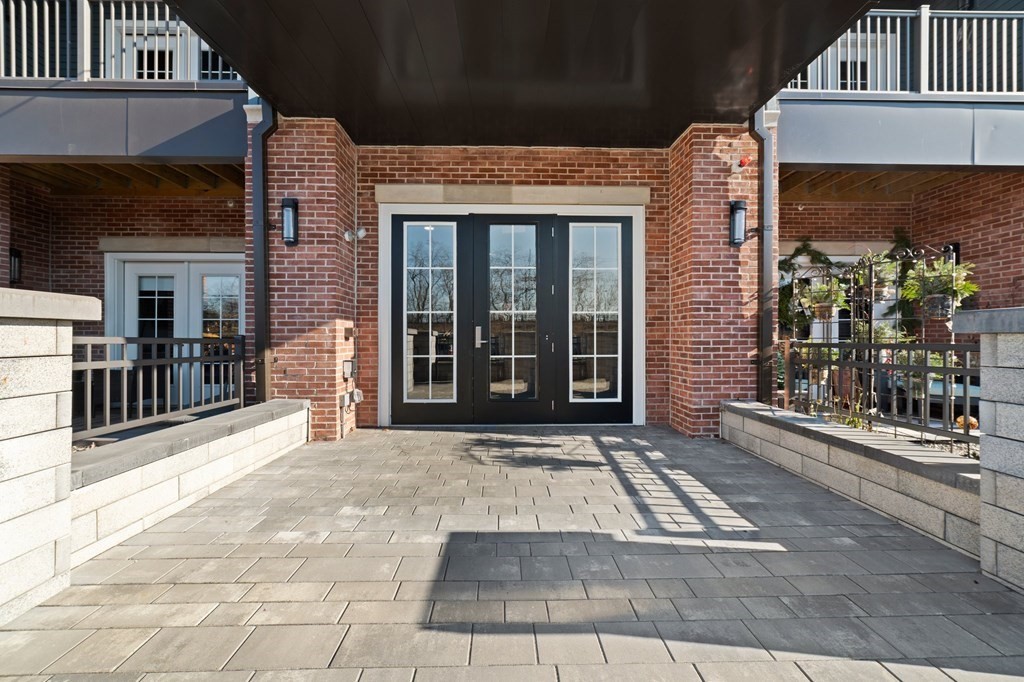 60 Coppersmith Way, Unit 404 Canton, MA 02021 - Photo 3 of 42 a view of a brick building with many windows