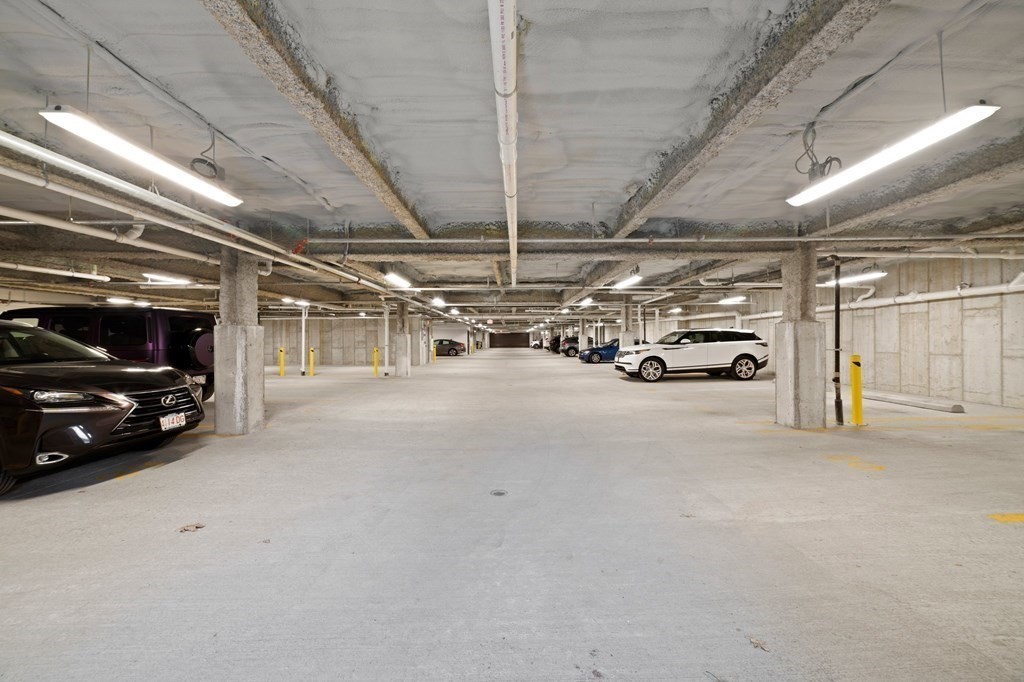60 Coppersmith Way, Unit 404 Canton, MA 02021 - Photo 37 of 42 a view of parking garage with cars