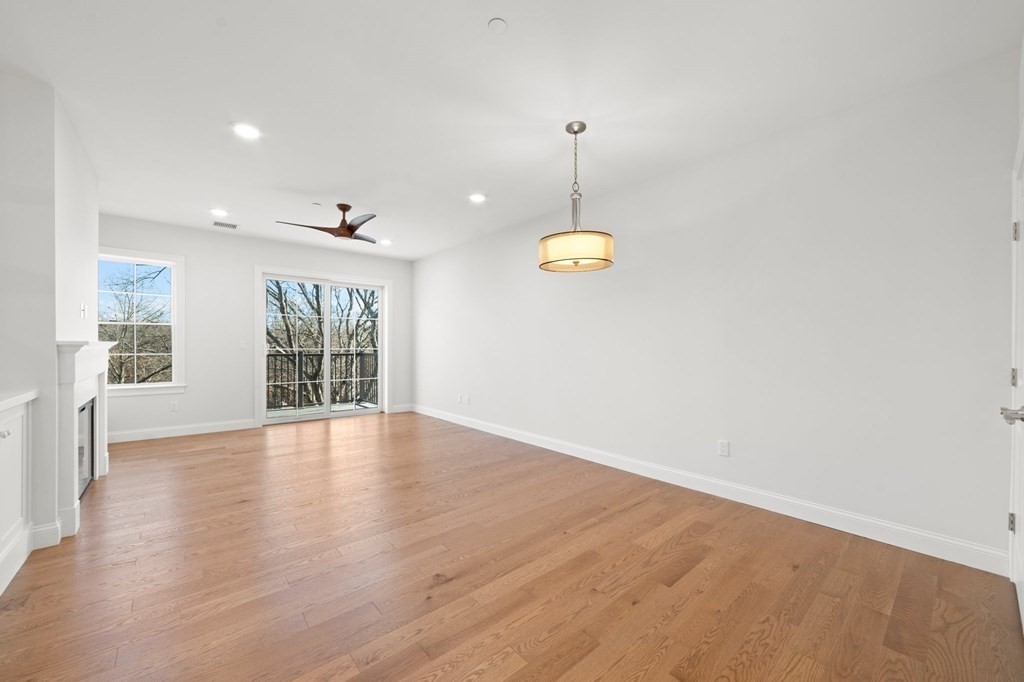 60 Coppersmith Way, Unit 404 Canton, MA 02021 - Photo 7 of 42 a view of an empty room with a window