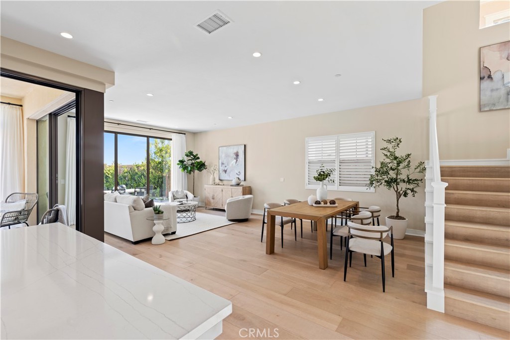 128 Tomahawk Irvine, CA 92618 - Photo 12 of 62 a living room with furniture potted plant and a large window