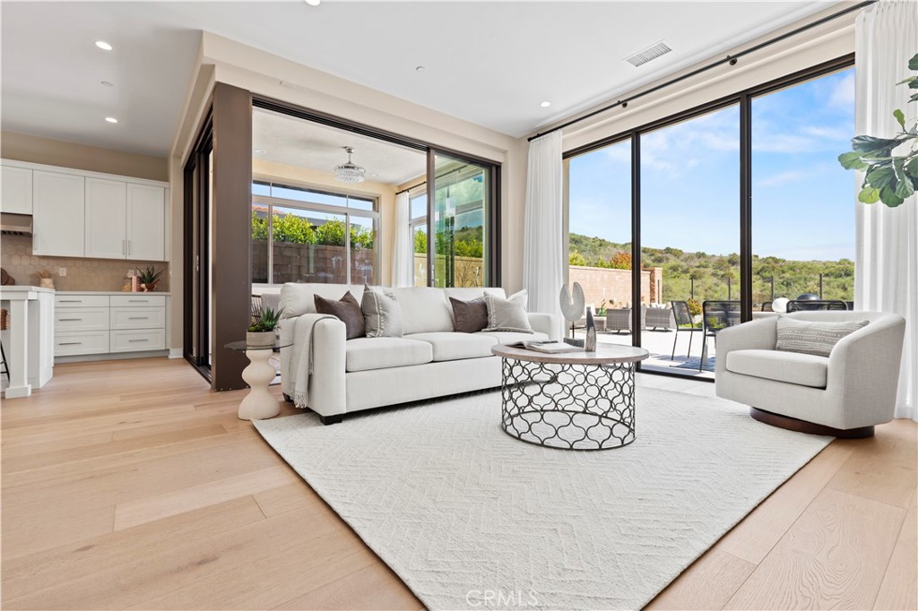 128 Tomahawk Irvine, CA 92618 - Photo 14 of 62 a living room with furniture and floor to ceiling windows
