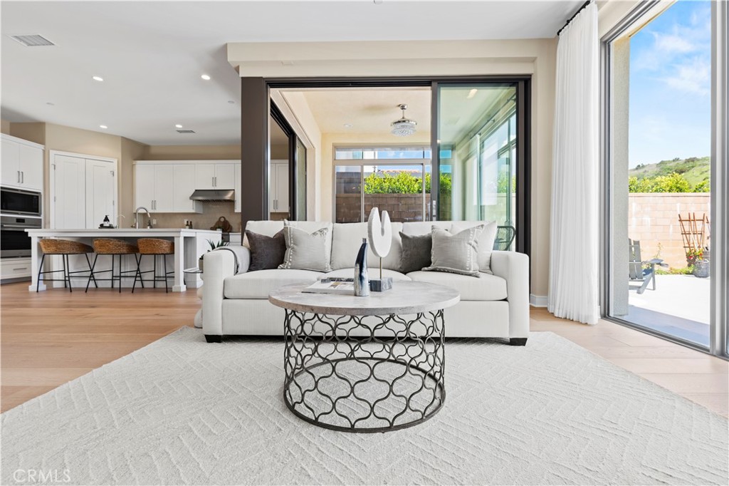 128 Tomahawk Irvine, CA 92618 - Photo 15 of 62 a living room with furniture and a large window