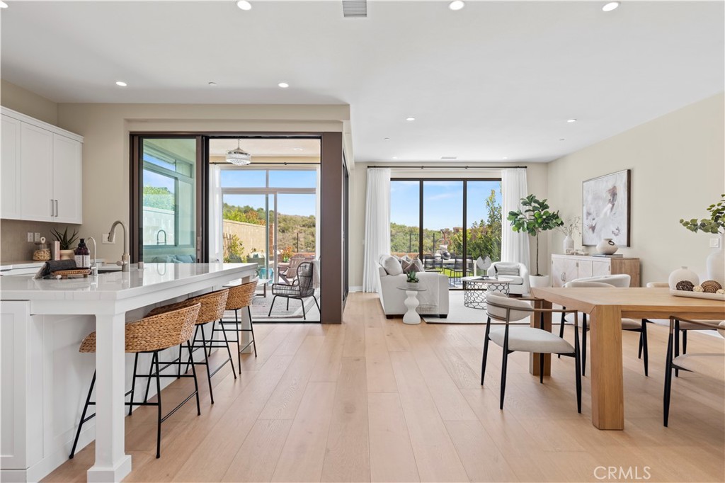 128 Tomahawk Irvine, CA 92618 - Photo 2 of 62 a room with lots of furniture a large window and furniture