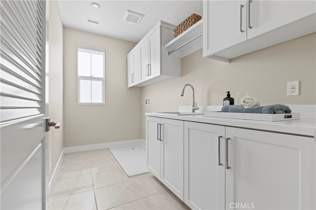 128 Tomahawk Irvine, CA 92618 - Photo 24 of 62 a bathroom with a sink and a mirror