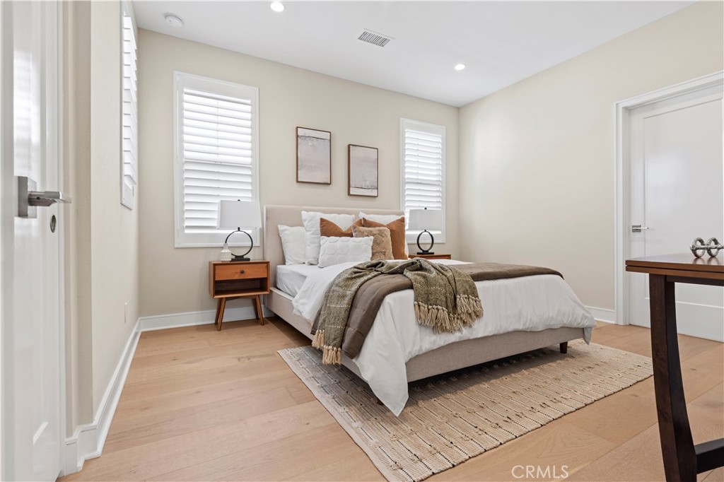 128 Tomahawk Irvine, CA 92618 - Photo 29 of 62 a bedroom with a bed and a night stand