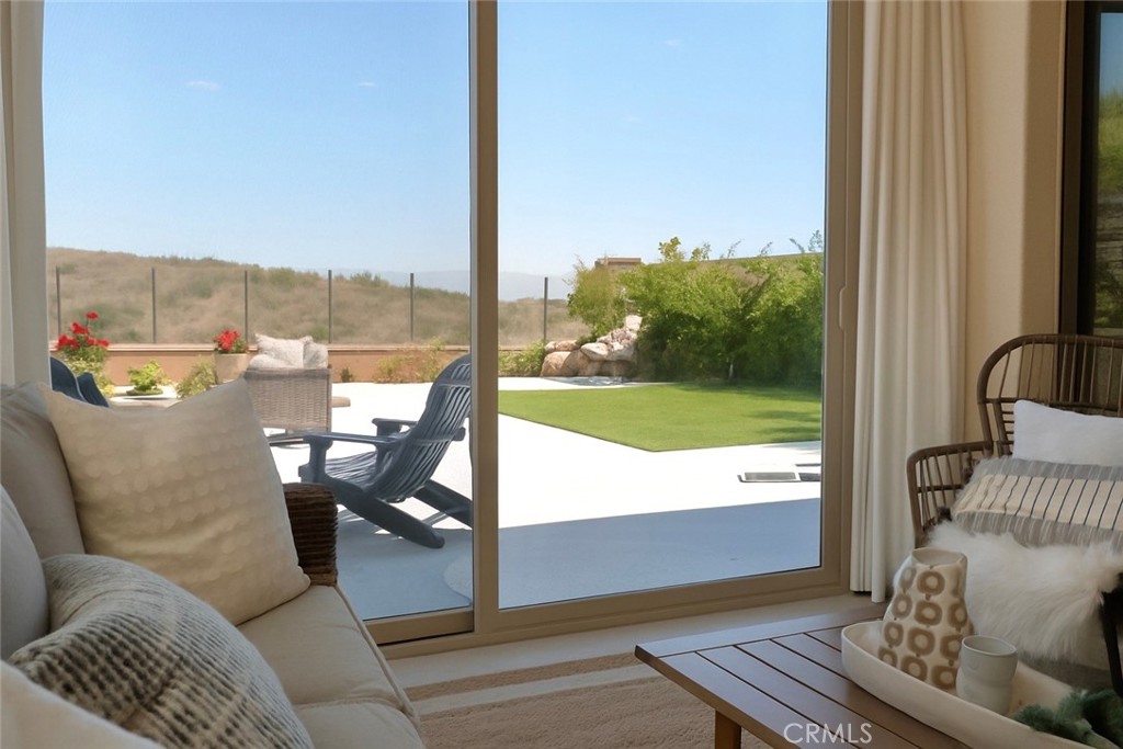 128 Tomahawk Irvine, CA 92618 - Photo 3 of 62 a living room with furniture and a floor to ceiling window