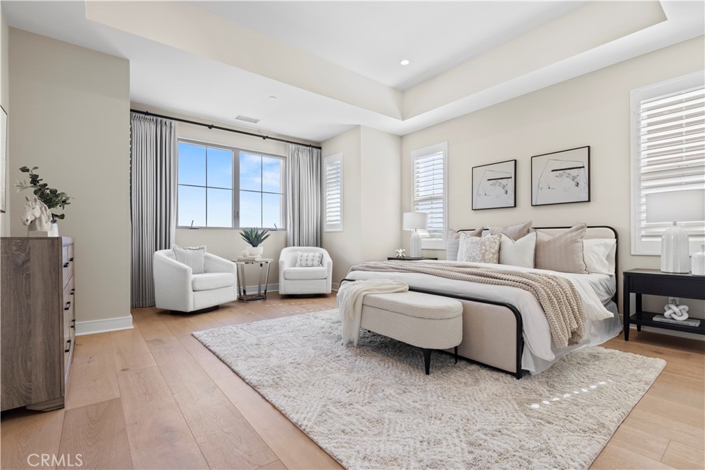 128 Tomahawk Irvine, CA 92618 - Photo 31 of 62 a spacious bedroom with a bed and a couch