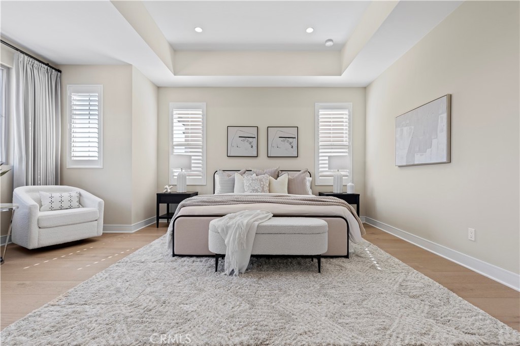 128 Tomahawk Irvine, CA 92618 - Photo 32 of 62 a spacious bedroom with a bed and a couch