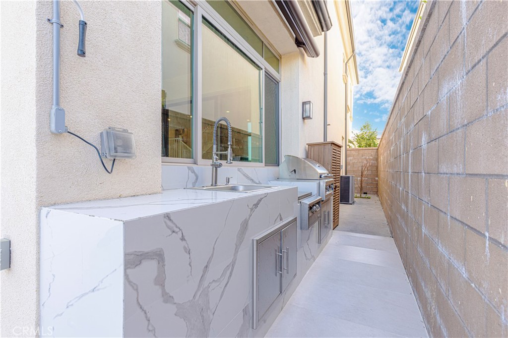 128 Tomahawk Irvine, CA 92618 - Photo 41 of 62 a view of a kitchen with a sink and large windows