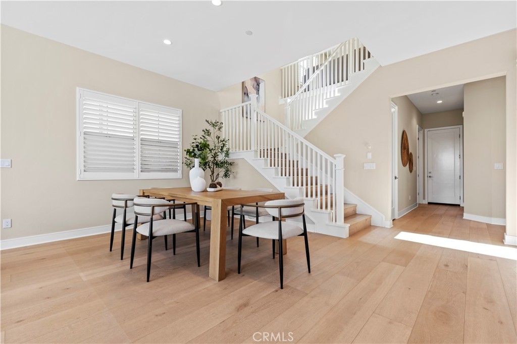 128 Tomahawk Irvine, CA 92618 - Photo 7 of 62 a view of a dining room with furniture and wooden floor