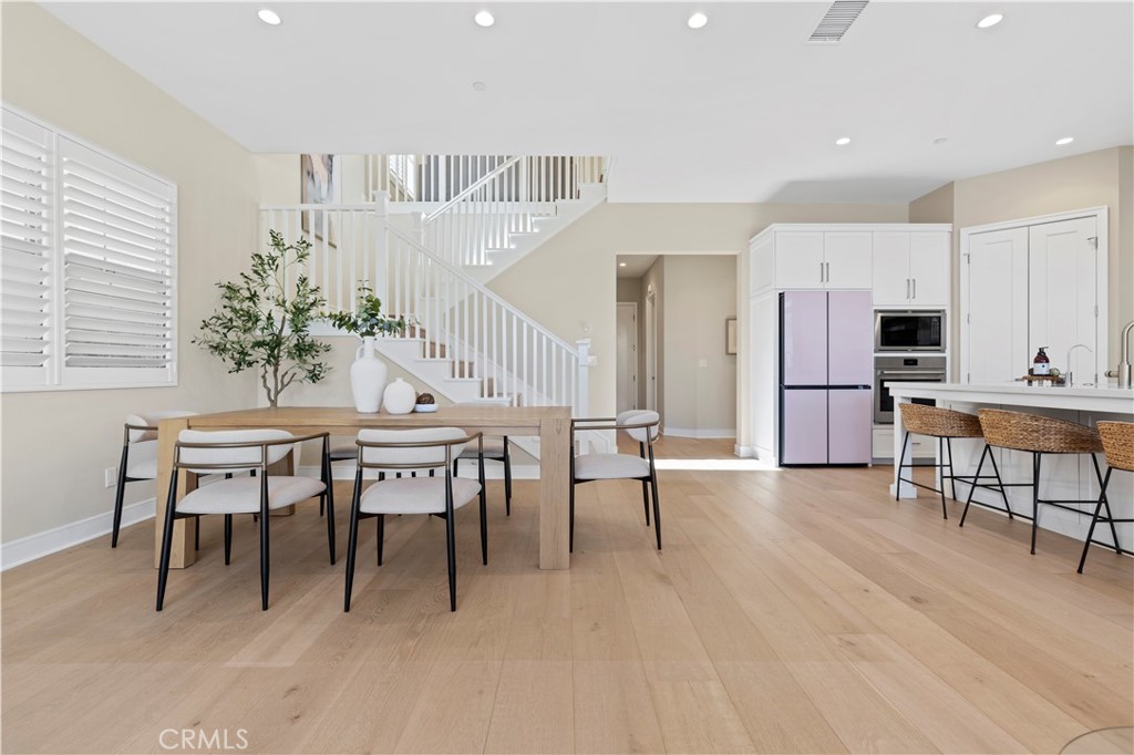 128 Tomahawk Irvine, CA 92618 - Photo 9 of 62 a view of a dining room with furniture and wooden floor