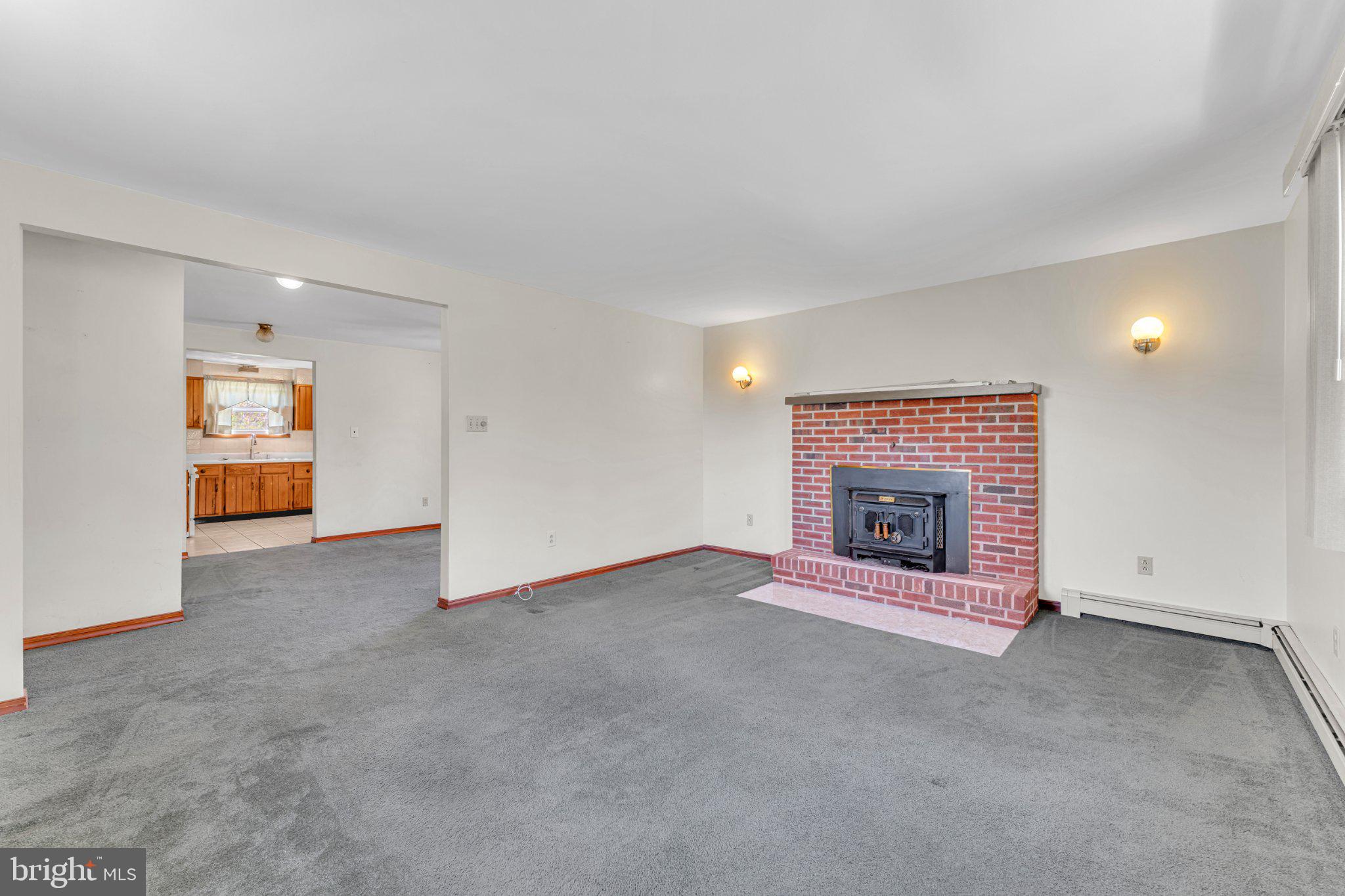 49 Piercetown Road Bridgeton, NJ 08302 - Photo 9 of 23 Spacious living area with cozy fireplace.