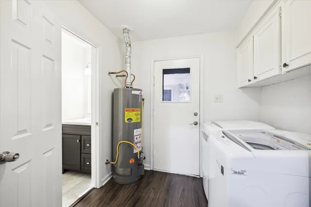 a storage room with wooden floor and cabinets