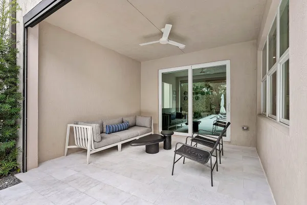 a view of a backyard with swimming pool