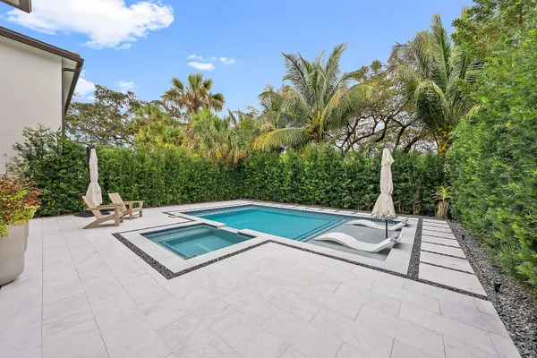 a view of swimming pool with outdoor seating