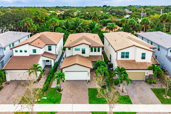 an aerial view of residential houses with outdoor space