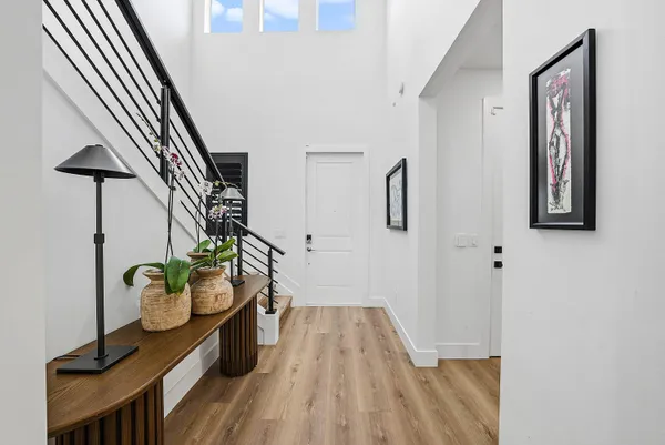 a view of entryway with wooden floor