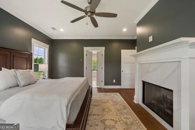 a bedroom with a bed and a fireplace