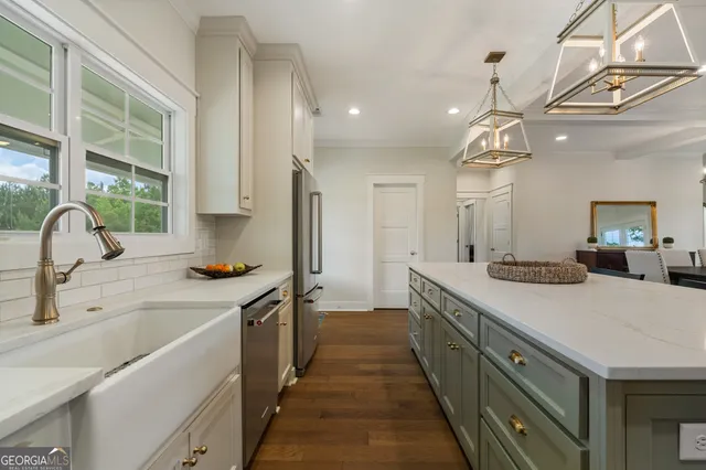 a kitchen with a stove and a sink