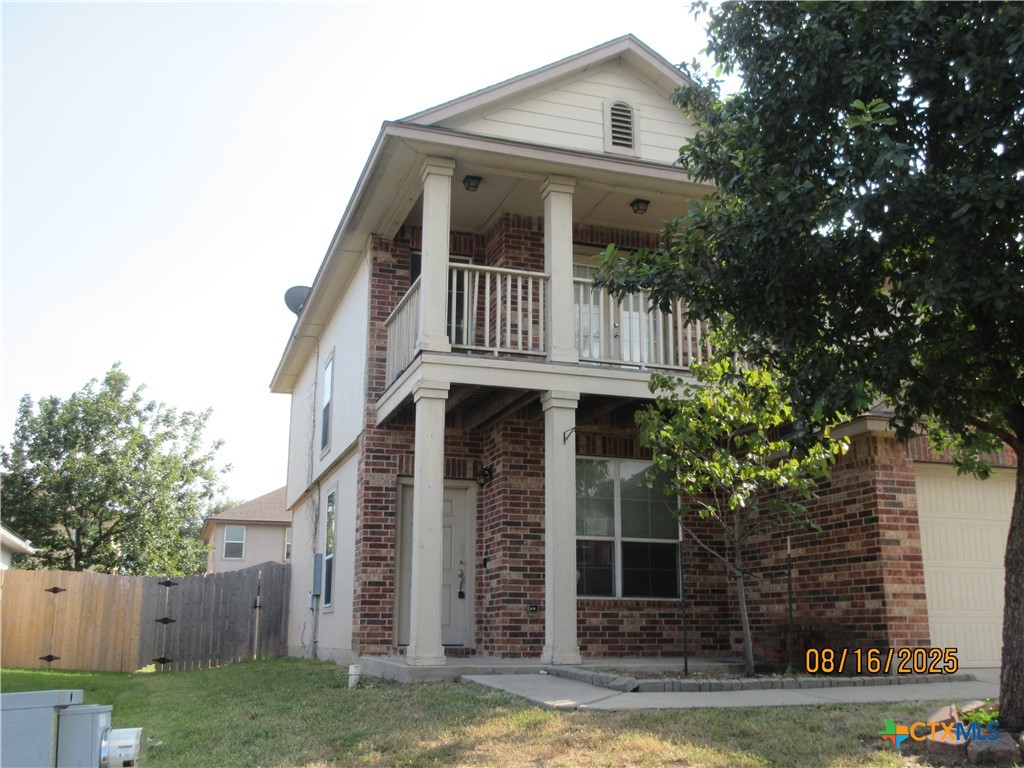 116 Langtry Lane Jarrell, TX 76537 - Photo 1 of 1 a front view of a house with garden