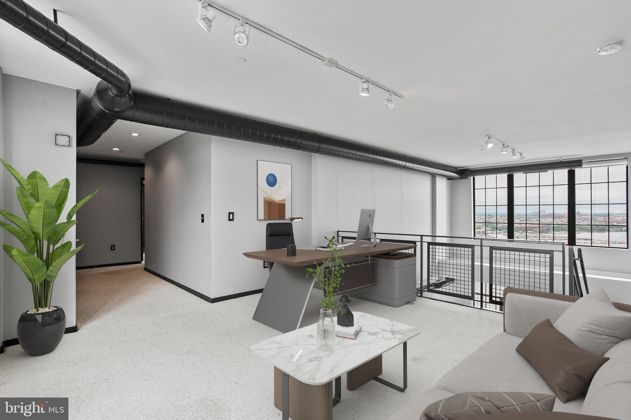 1200 Steuart Street, Unit 1913 Baltimore, MD 21230 - Photo 19 of 39 a kitchen with a table and chairs in it