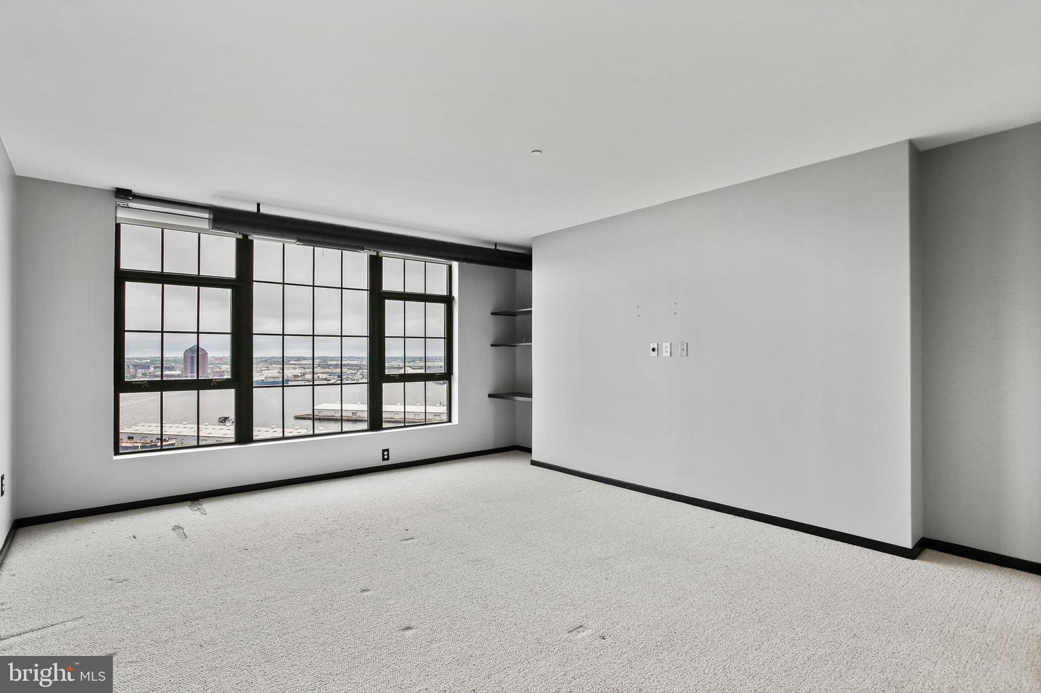 1200 Steuart Street, Unit 1913 Baltimore, MD 21230 - Photo 24 of 39 a view of an empty room with a window
