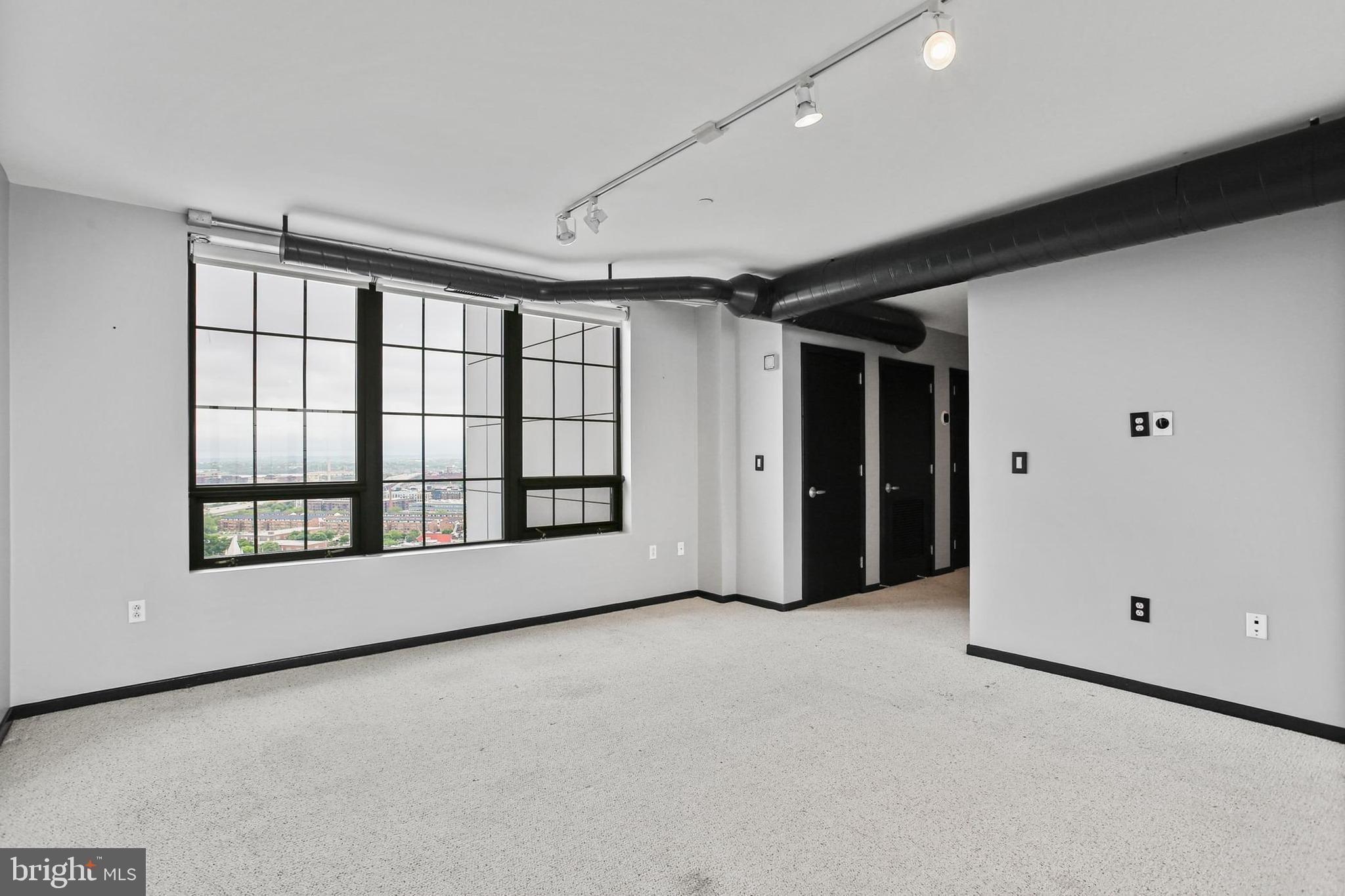 1200 Steuart Street, Unit 1913 Baltimore, MD 21230 - Photo 26 of 39 a view of an empty room with a window