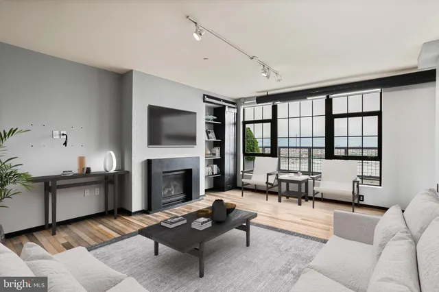 a living room with furniture fireplace and a flat screen tv