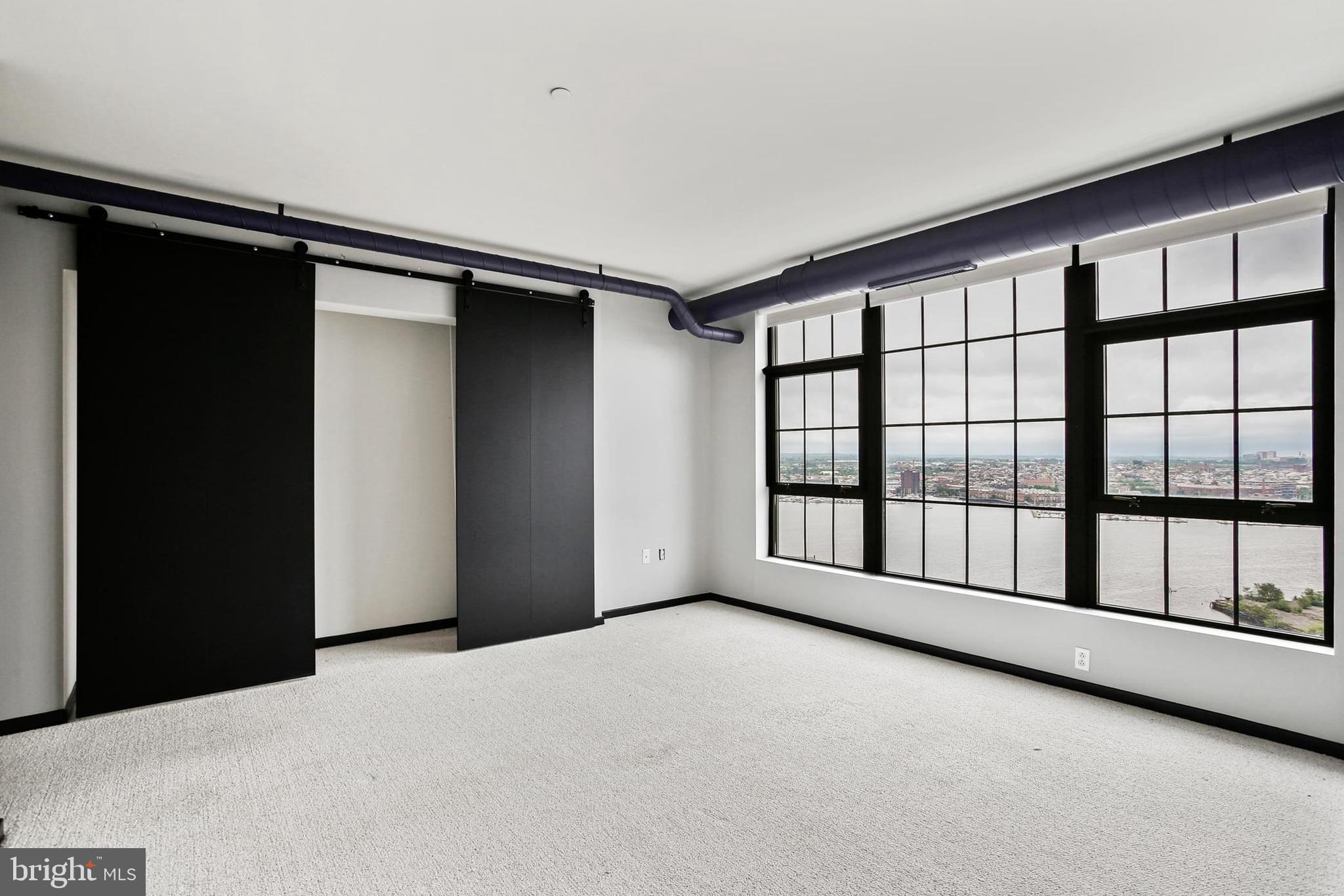 1200 Steuart Street, Unit 1913 Baltimore, MD 21230 - Photo 31 of 39 a view of an empty room with window