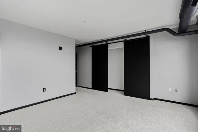 a bathroom with a bathtub sink vanity mirror and toilet