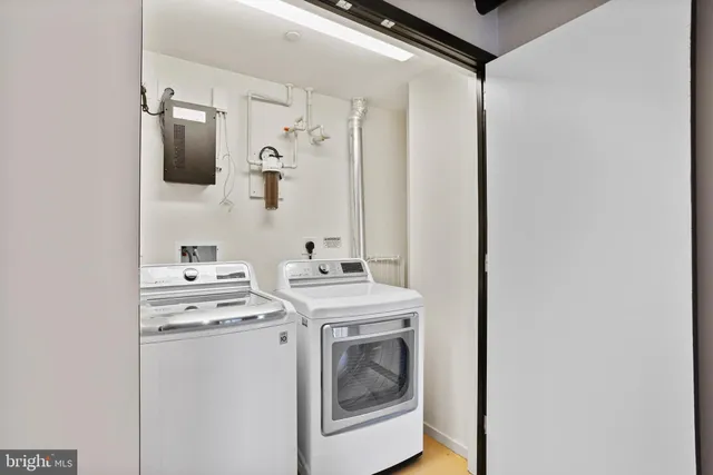 a bathroom with a sink toilet and mirror