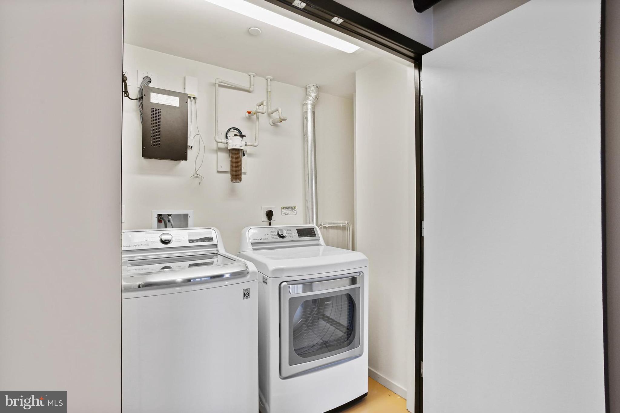 1200 Steuart Street, Unit 1913 Baltimore, MD 21230 - Photo 34 of 39 a utility room with dryer and washer