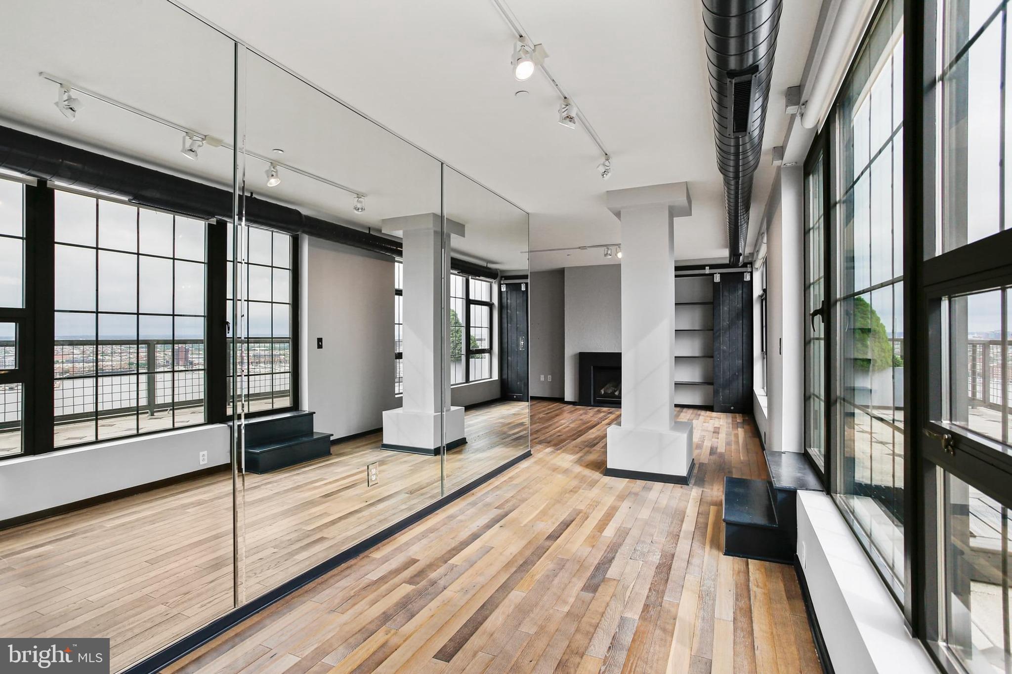 1200 Steuart Street, Unit 1913 Baltimore, MD 21230 - Photo 8 of 39 a view of a living room with a large window