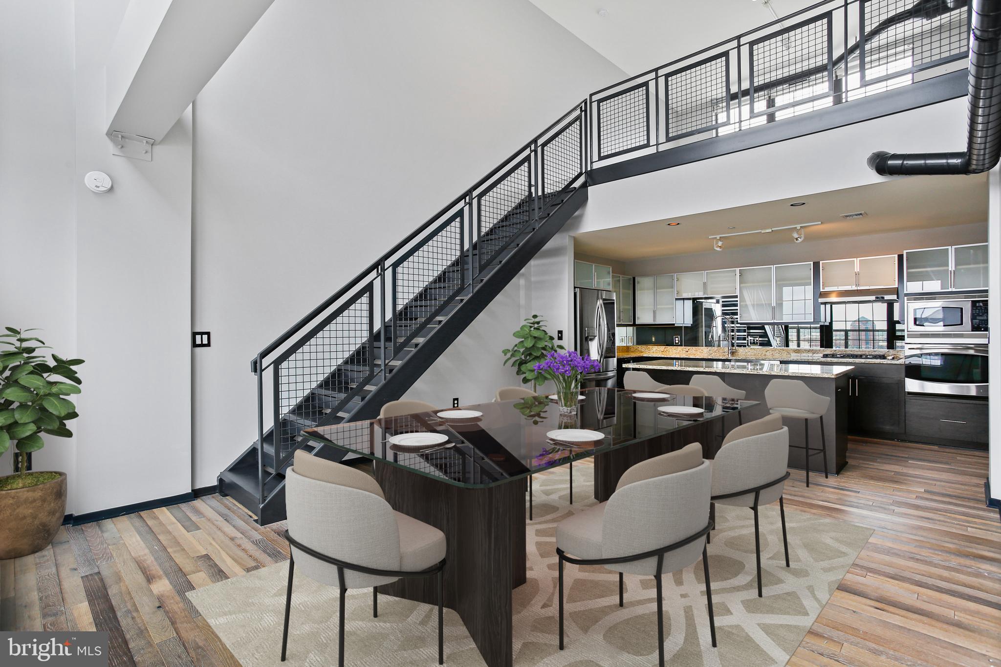 1200 Steuart Street, Unit 1913 Baltimore, MD 21230 - Photo 9 of 39 a dining room with furniture and wooden floor