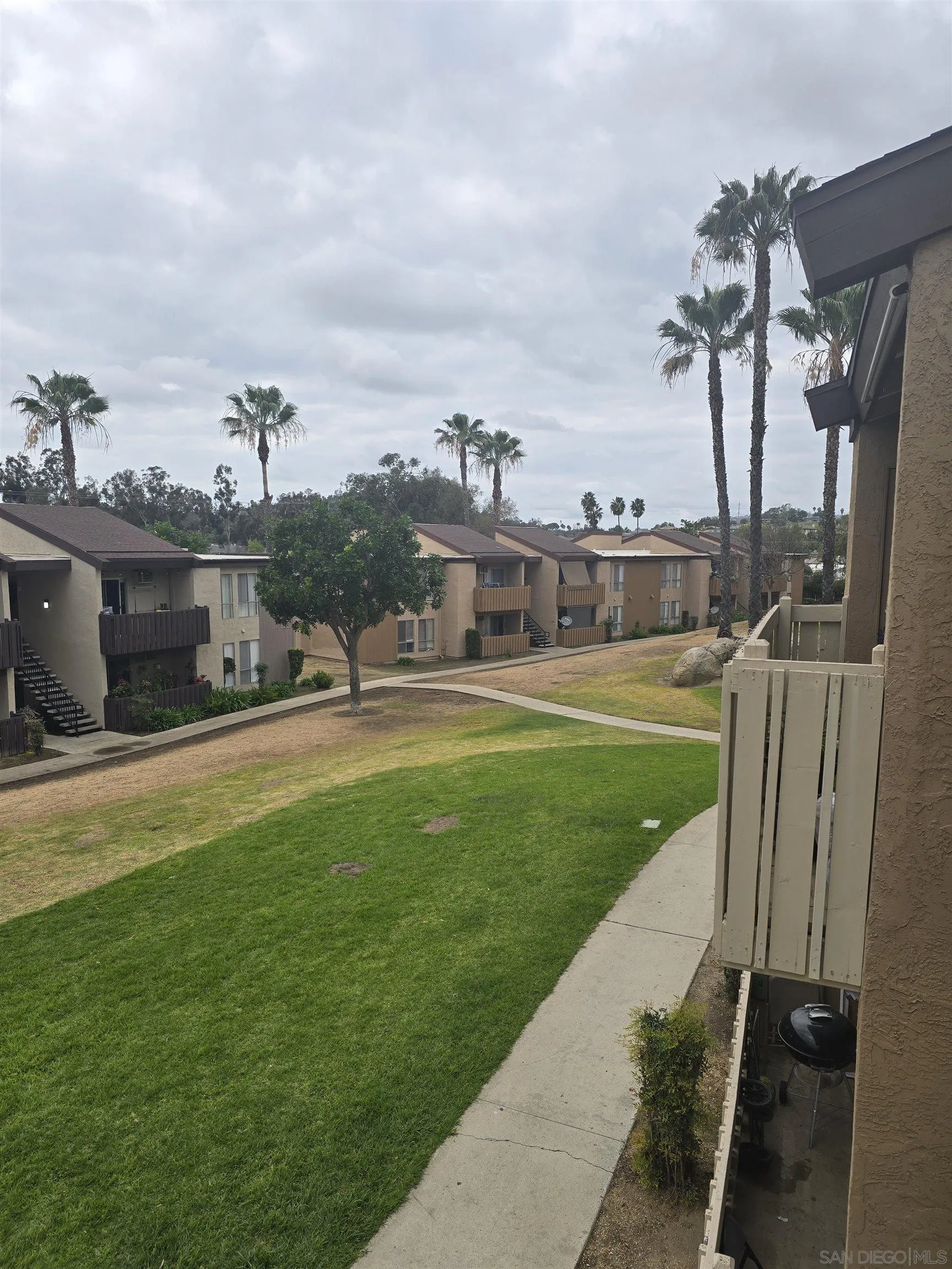 1050 Rock Springs Road, Unit 240 Escondido, CA 92026 - Photo 13 of 21 a view of a fountain in front of a house