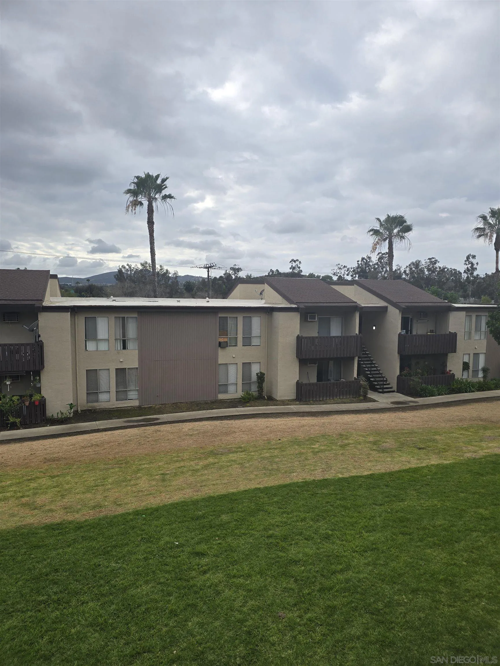1050 Rock Springs Road, Unit 240 Escondido, CA 92026 - Photo 14 of 21 a front view of a house with a garden