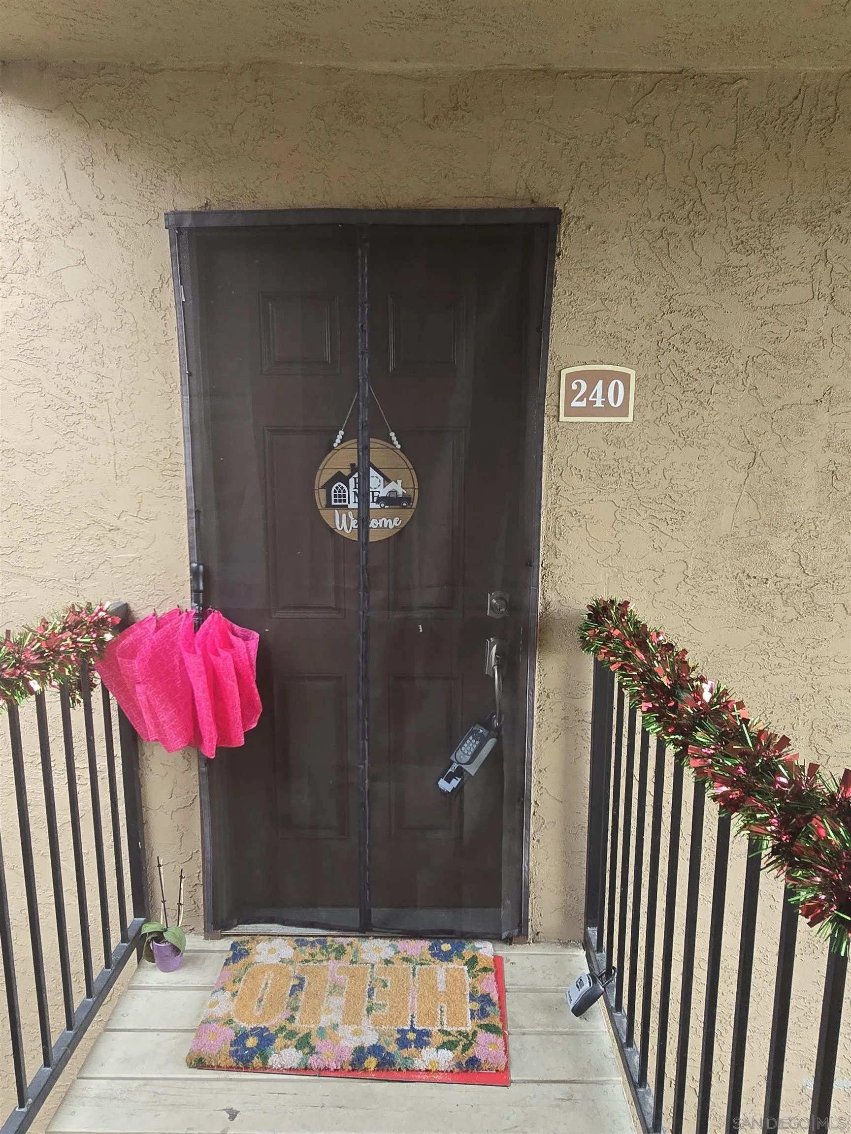 1050 Rock Springs Road, Unit 240 Escondido, CA 92026 - Photo 3 of 21 a view of a entryway door of the house