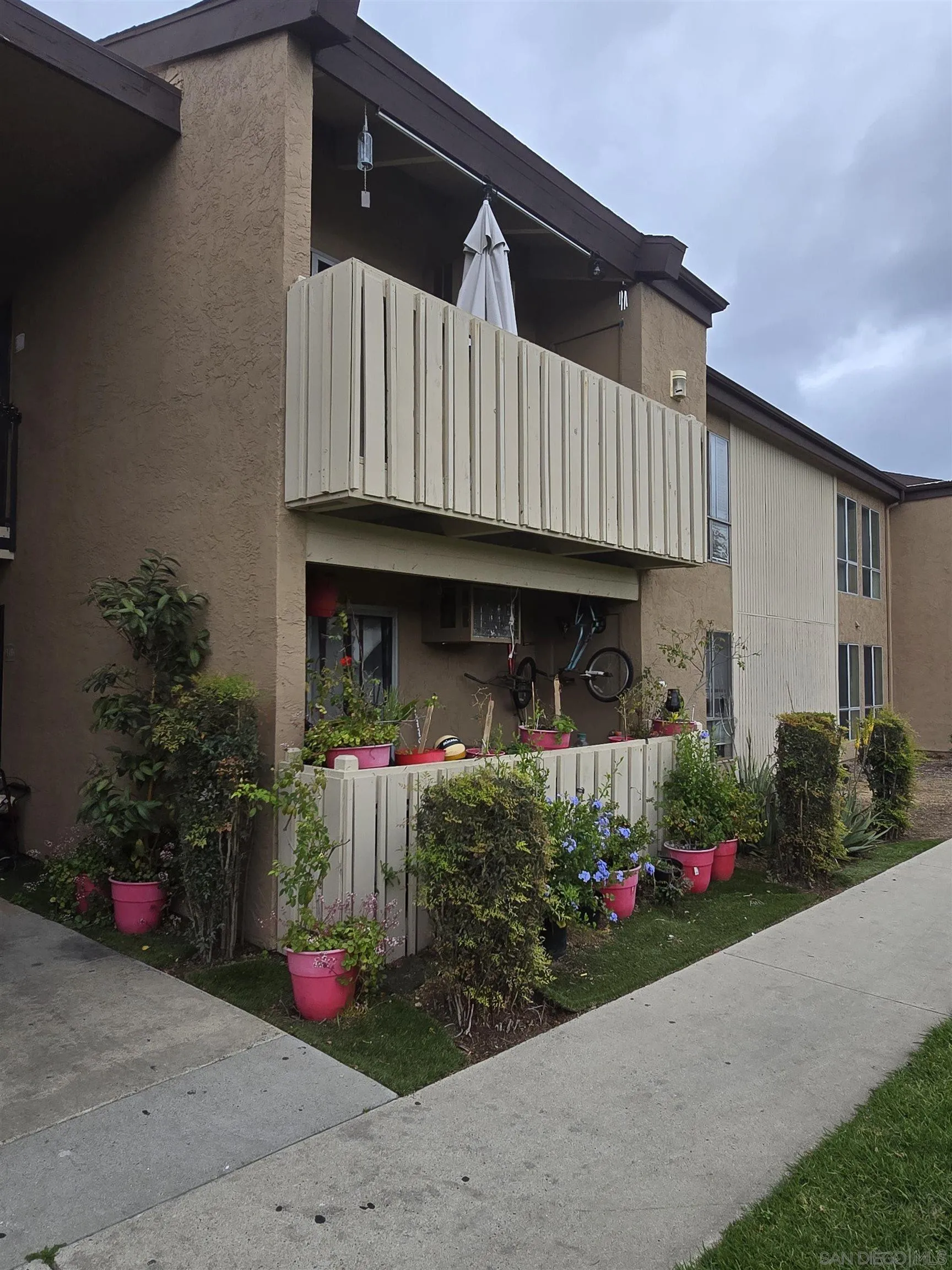 1050 Rock Springs Road, Unit 240 Escondido, CA 92026 - Photo 5 of 21 a front view of a house with yard