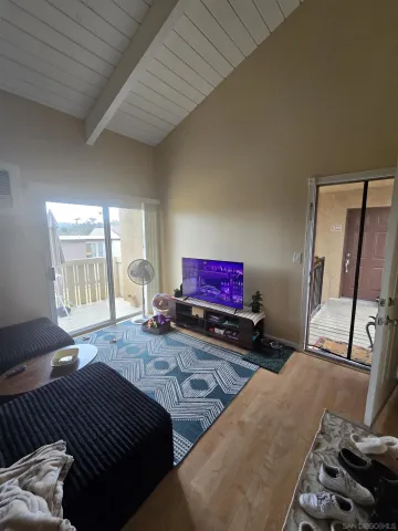 a large white kitchen with a stove a sink dishwasher and a refrigerator