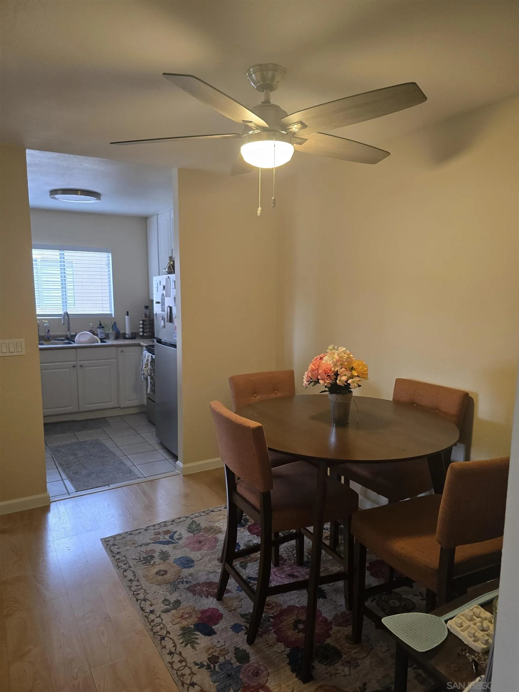 1050 Rock Springs Road, Unit 240 Escondido, CA 92026 - Photo 10 of 21 a view of a dining room with furniture and wooden floor