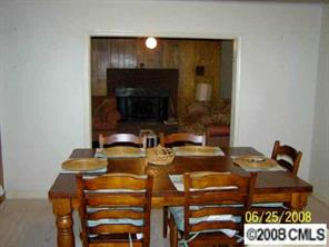 702 Miles Road Dallas, NC 28034 - Photo 3 of 7 a dining room with furniture and a fireplace