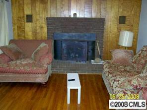 702 Miles Road Dallas, NC 28034 - Photo 4 of 7 a living room with furniture and a fireplace