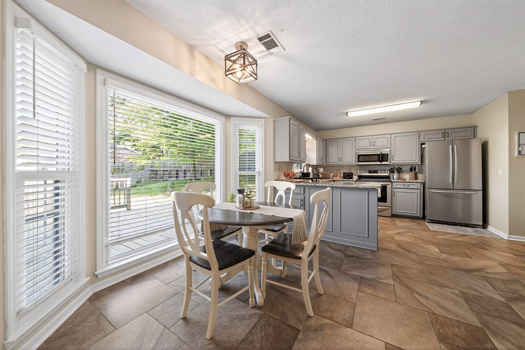 7333 Cedar Creek Loop Columbus, GA 31904 - Photo 7 of 37 a view of a dining room with furniture window and outside view