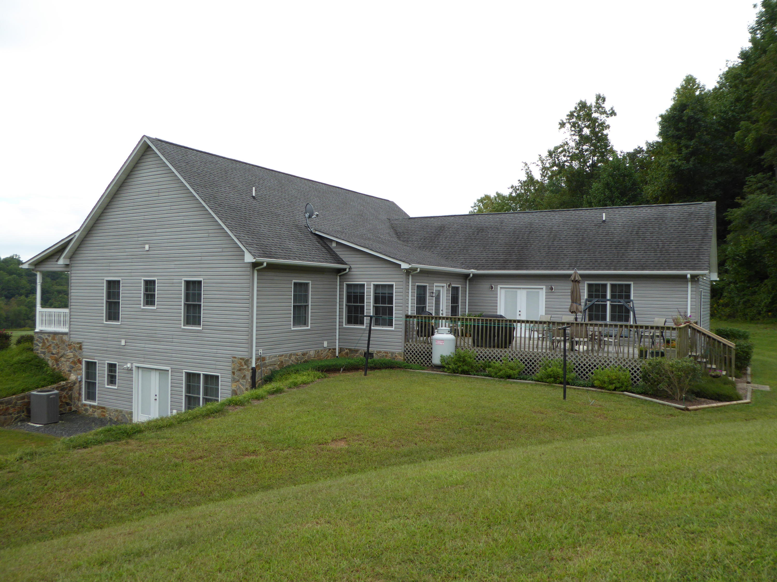 12419 Callaway Road Callaway, VA 24067 - Photo 15 of 96 a aerial view of a house next to a big yard and large trees