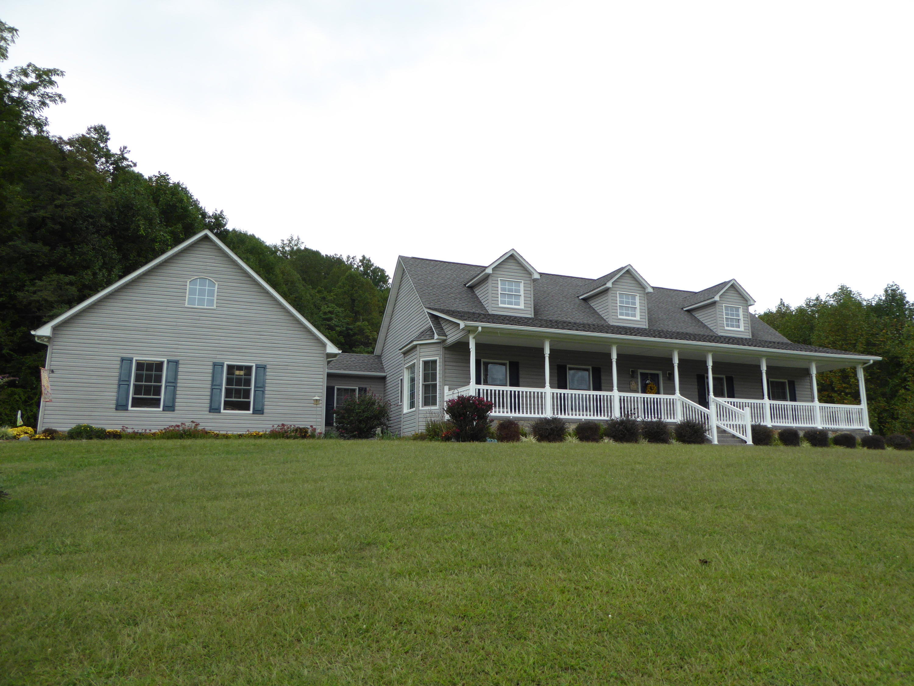 12419 Callaway Road Callaway, VA 24067 - Photo 16 of 96 a view of a house with a yard and potted plants